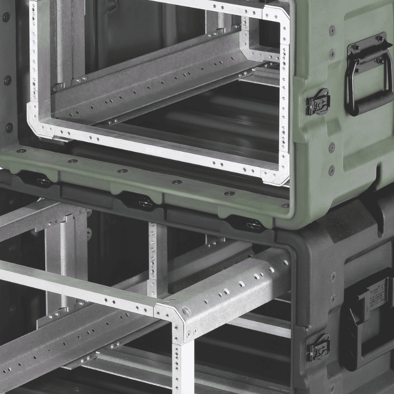 Assorted stack of Peli-style hard cases in various sizes and colors, designed for rugged transport and protective equipment storage.